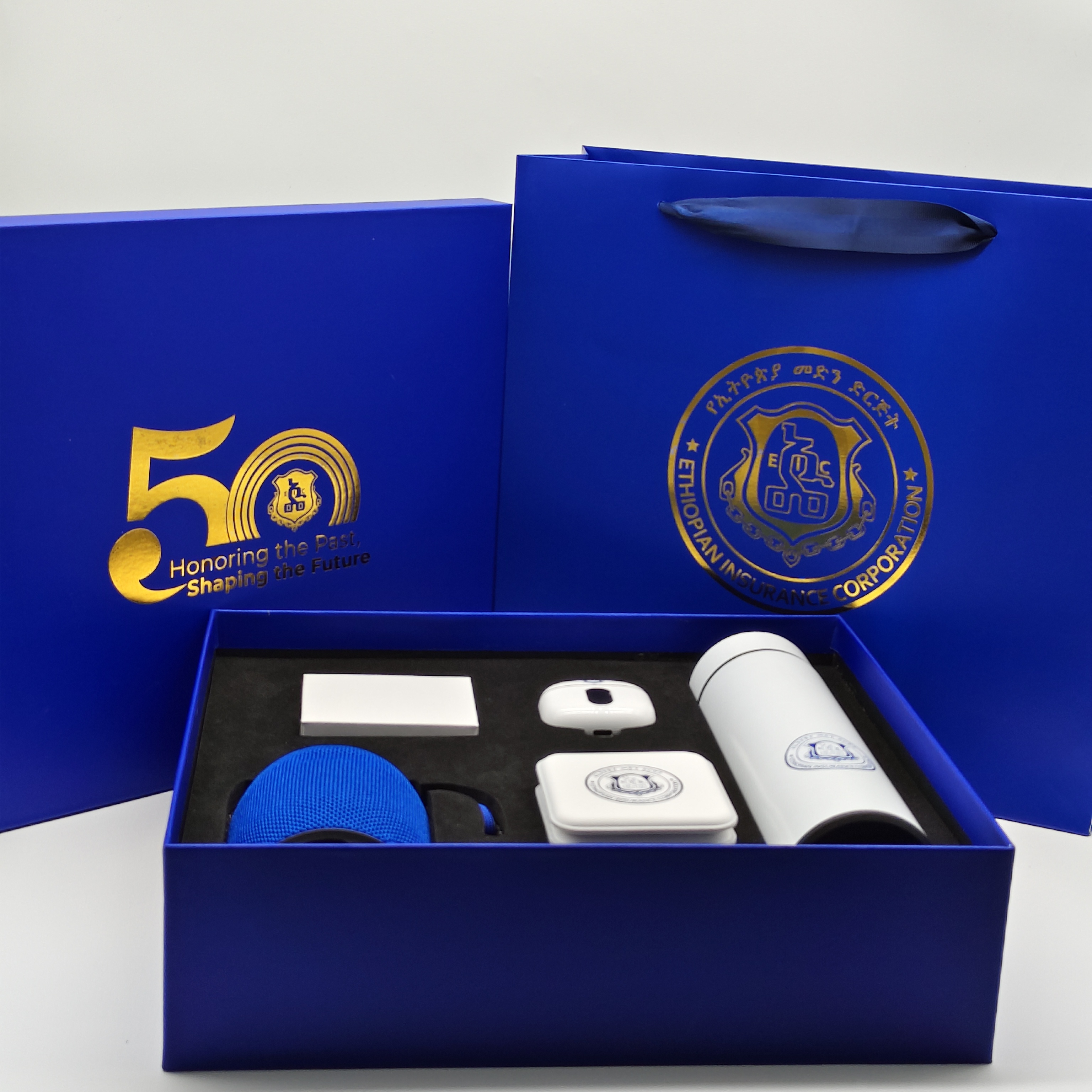 Product: Blue Speaker + 3 in 1 wireless charger(white)  + earphone(white) + thermos cup with temperature  display  (whit